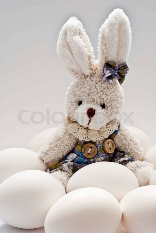 Toy rabbit with easter eggs, stock photo