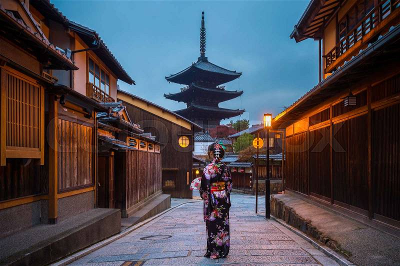 Asian woman wearing japanese traditional kimono at Yasaka Pagoda and Sannen Zaka Street in Kyoto, Japan, stock photo