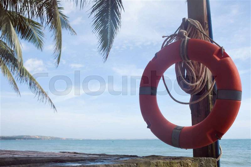 Red buoy for life saving on the beach. equipment for the rescue on water, stock photo