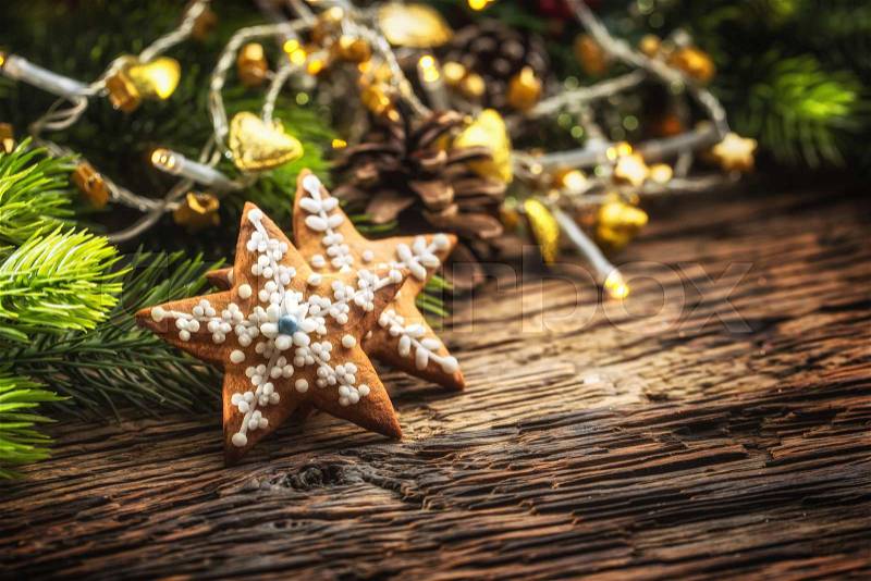 Christmas cake ginderbread. Christmas stars cakes and decoration on rustic oak table, stock photo
