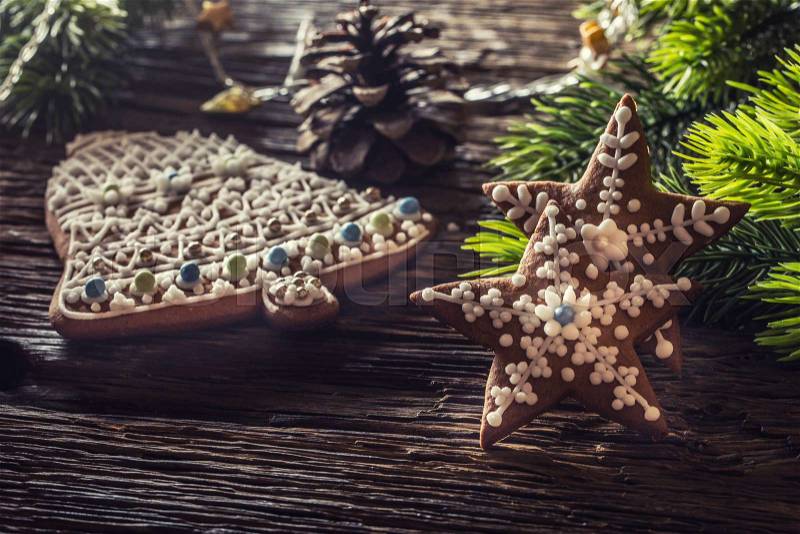 Christmas cake ginderbread. Christmas stars bell cakes and decoration on rustic oak table, stock photo