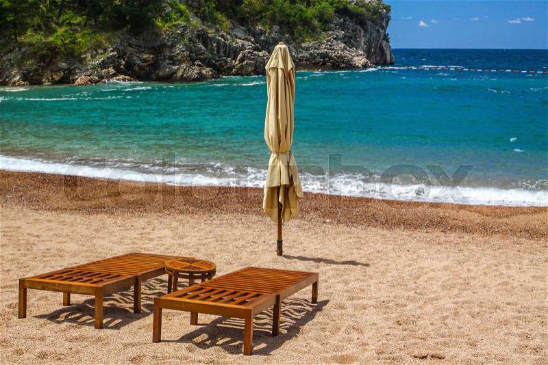 Empty beach with two chairs, Famous Queen\'s Beach (Kraljicina Plaza), Milocer, Montenegro, stock photo