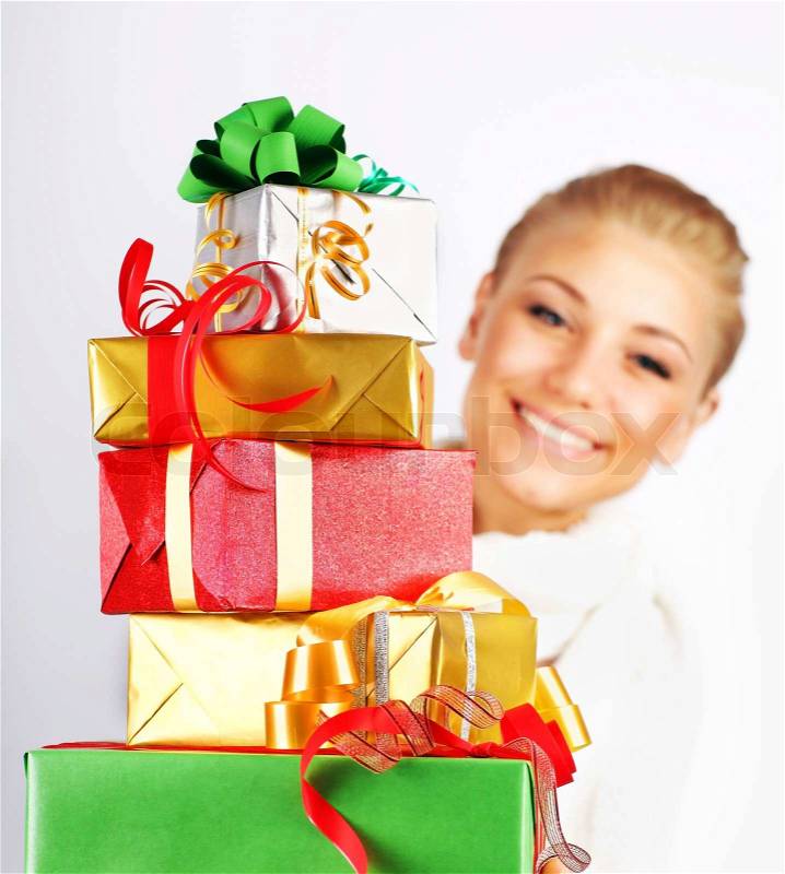 Happy girl smiling, holding colorful holiday presents &amp; gift boxes as Christmas &amp; new year ornament decoration isolated on white background, stock photo - 3005180-happy-girl-smiling-holding-colorful-holiday-presents-gift-boxes-as-christmas-new-year-ornament-decoration-isolated-on-white-background