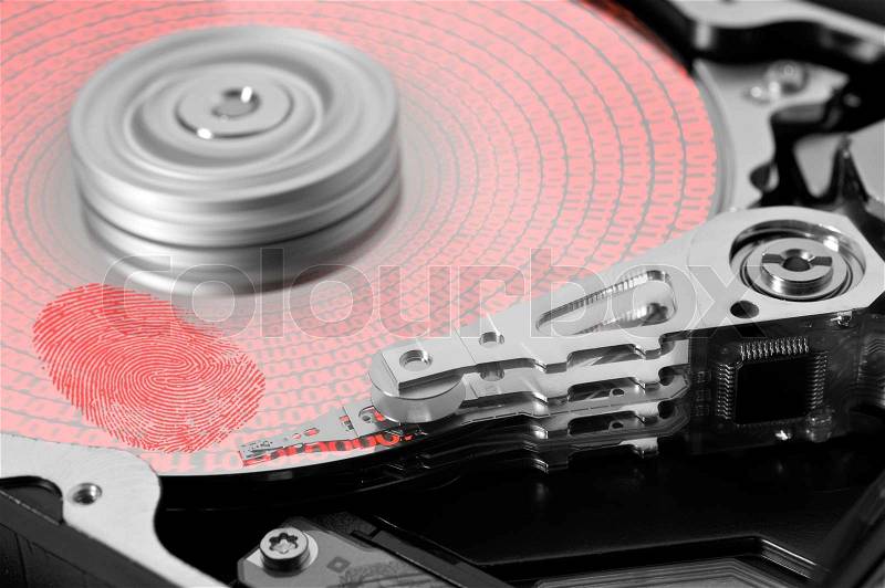 Symbolic theme around data security showing a open hard disk with symbolic fingerprint and data, stock photo