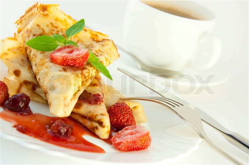 Fritters with strawberry jam and mint and a cup of coffee, stock photo