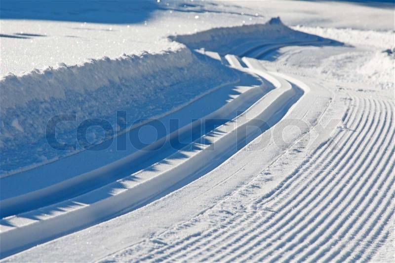 Freshly groomed empty cross-country ski track, stock photo