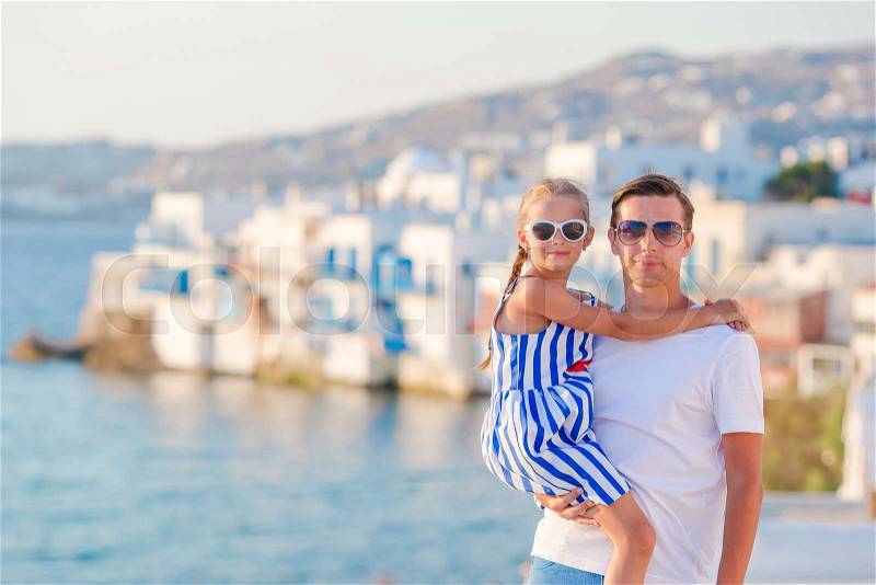 Family in Europe. Father and little girl background Little Venice in Mykonos, Greece, stock photo