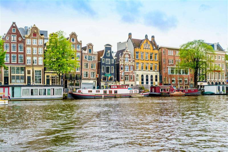 Amsterdam, the Netherlands, September 5, 2017 :typical dutch houses and houseboats. Amsterdam, Holland, Netherlands, stock photo