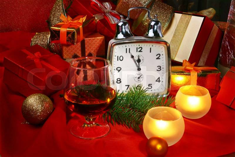 Christmas clock and candles. New Year\'s Decoration with gift boxes, christmas balls and tree. Celebration Concept for New Year, stock photo