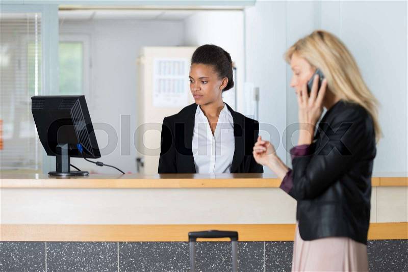 Guest at the front desk, stock photo