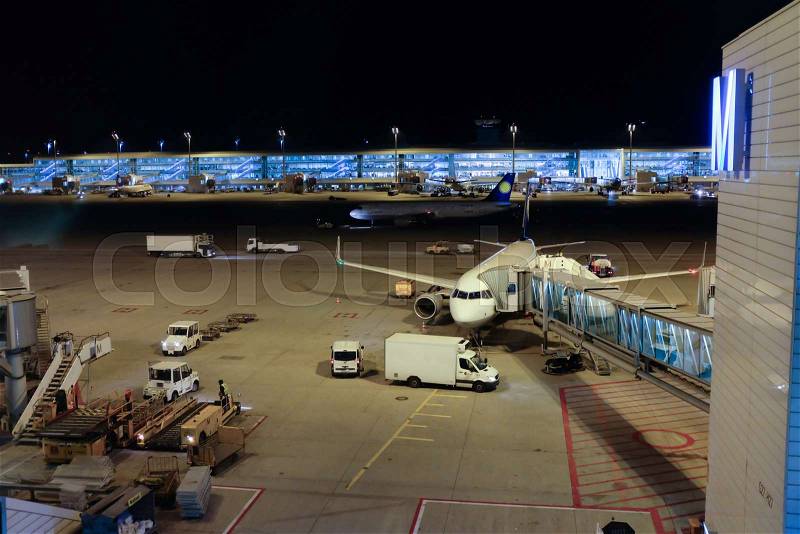 Airport at the night time. Boarding a plane, stock photo