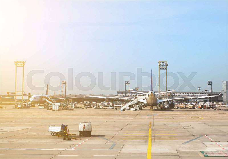 Passenger planes in the airport. Aircraft maintenance, stock photo
