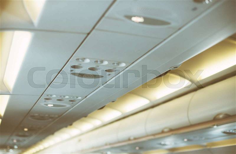 Interior inside of the plane with passengers, stock photo