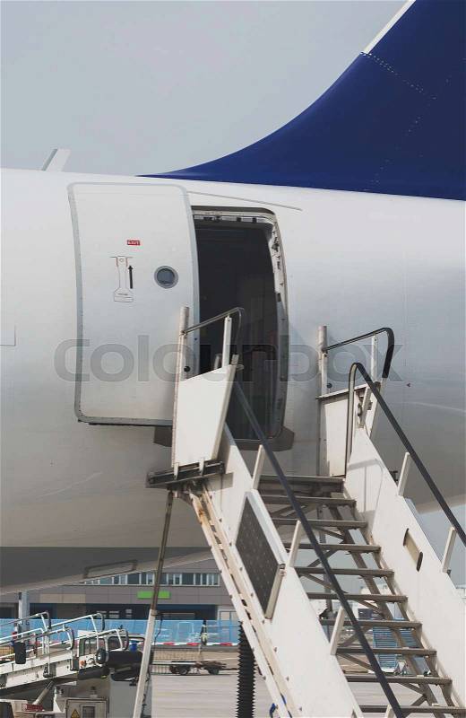 Welcome aboard. The open door in the plane, stock photo