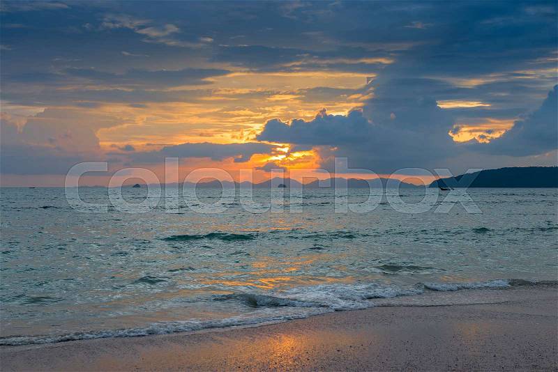Beautiful dark sunset sky over the sea surface in Thailand, stock photo