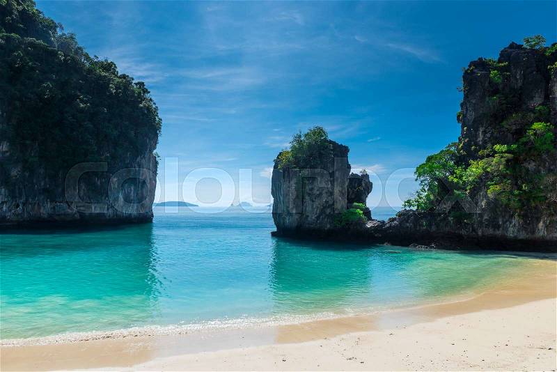 Sheer rocks, turquoise beautiful sea on a sunny day. view of the bay of the Andaman Sea - island of Hong, Thailand, stock photo