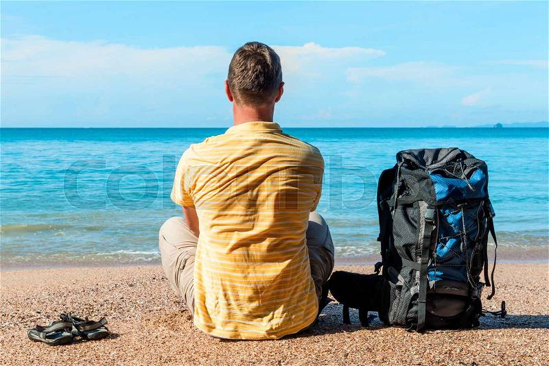 Conceptual photo - tourist on vacation by the sea, stock photo