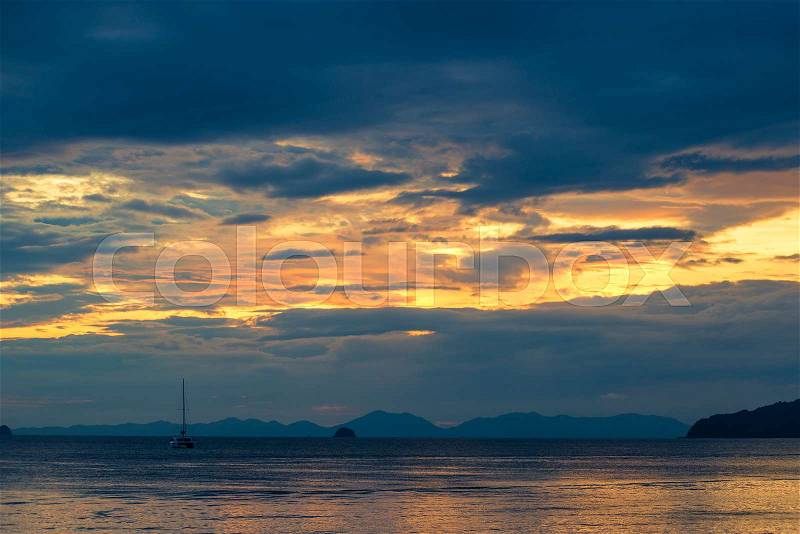 Beautiful bright sky at sunset over the tranquil Andaman Sea in Thailand, stock photo