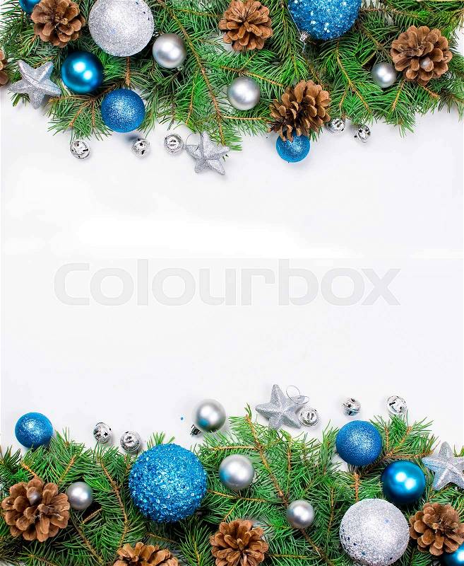 Decorative background with fir branches ,blue and silver balls on the white . Christmas card Holiday Concept. copy space, top view, stock photo
