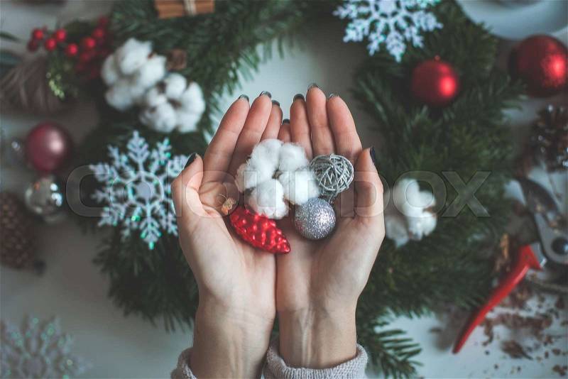 Christmas Concept. Christmas Decorations on Female Hands, stock photo