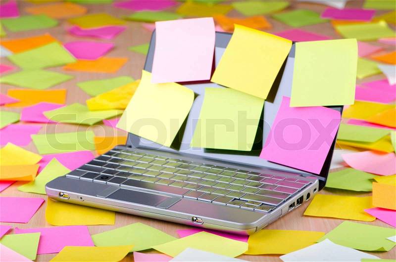 Netbook with reminder notes, stock photo