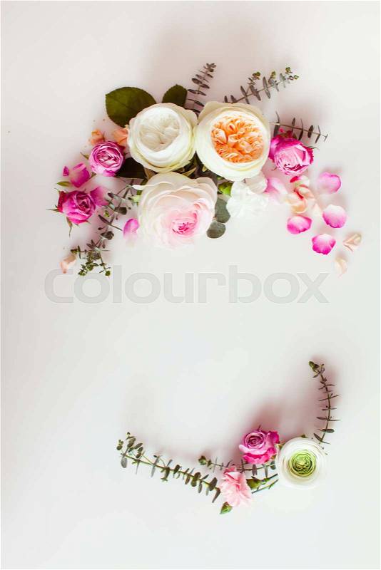 Floral round wedding frame flat lay. Rose flowers top view with copy space, stock photo