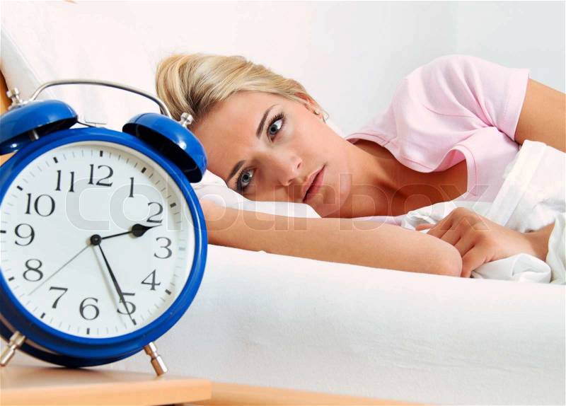 Clock with sleep at night woman can not sleep, stock photo