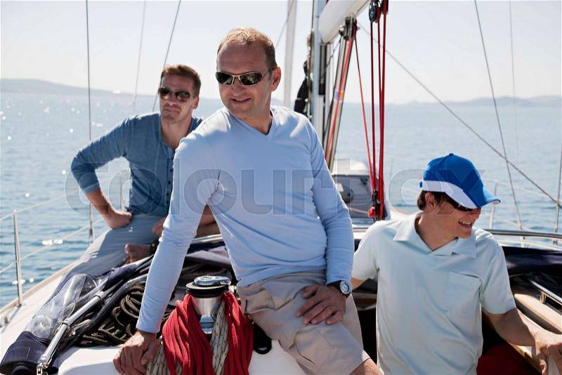 Men on yacht, stock photo
