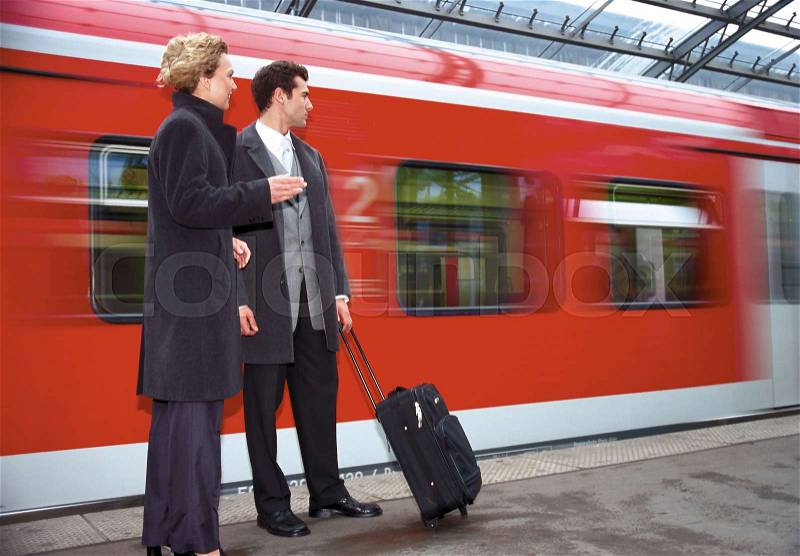 Business couple on platform, stock photo