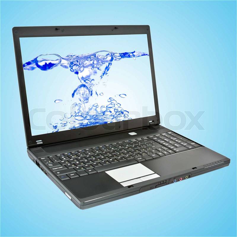 Laptop computer with water on screen, stock photo