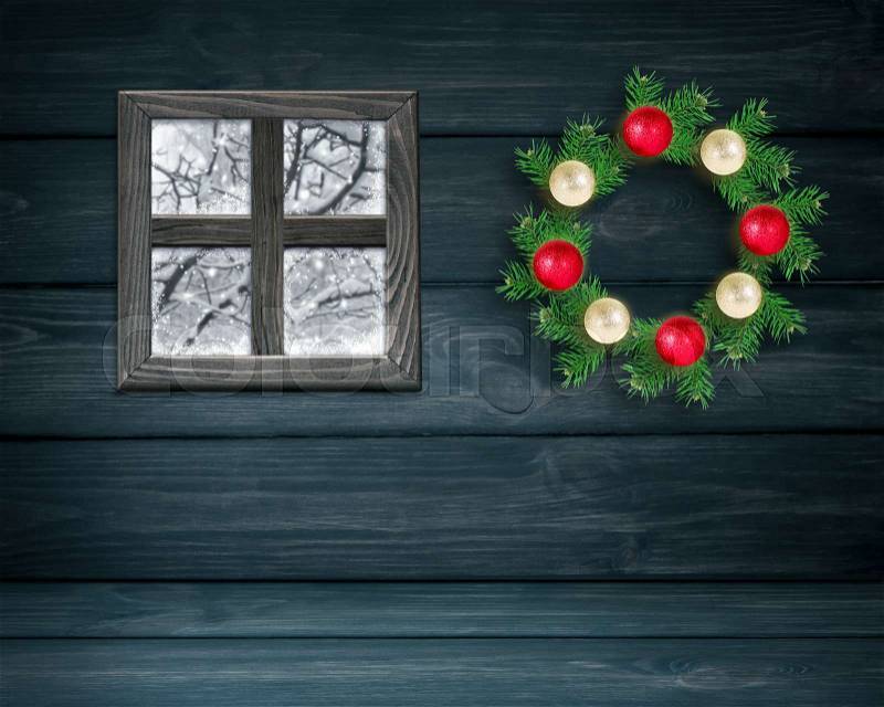 Christmas room interior with window and spruce wreath with balls on wooden wall background. New Year winter holidays concept. Copy space, stock photo