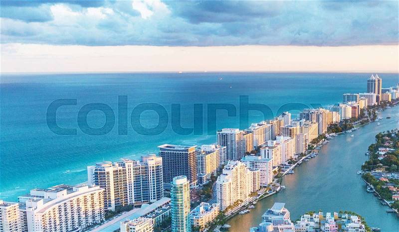 Miami Beach skyscrapers at dusk, Florida. Beautiful view from helicopter, stock photo