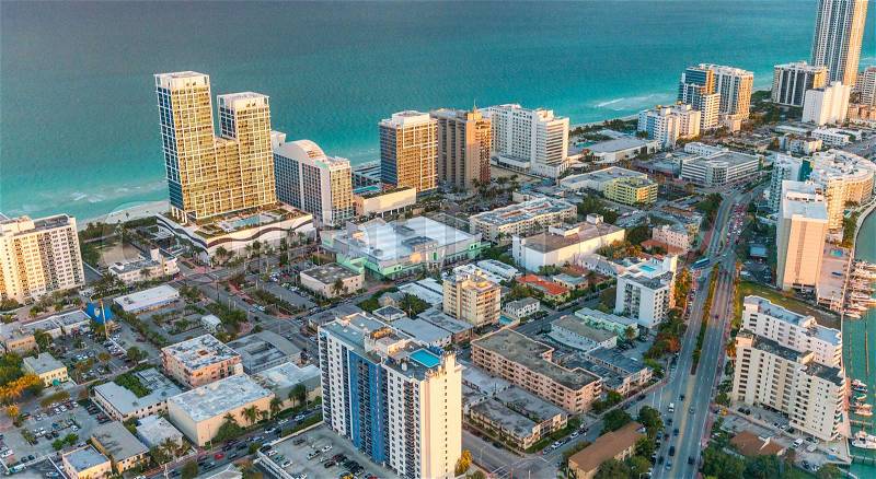 Miami Beach skyscrapers at dusk, Florida. Beautiful view from helicopter, stock photo