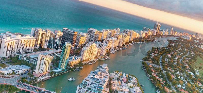Miami Beach buildings at dusk, aerial view from helicopter, stock photo