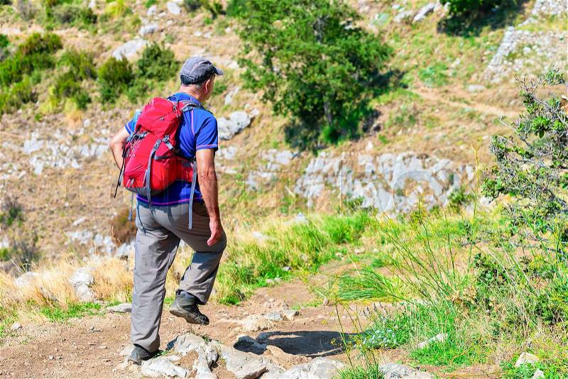 Man with backpack on Path of Gods, Amalfi coast, Italy, stock photo