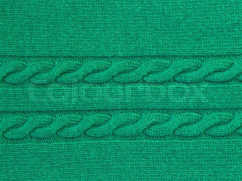 Background of knitted woolen green sweater texture, stock photo