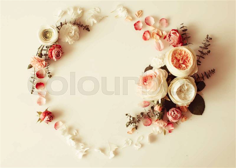Floral round wedding frame flat lay. Rose flowers top view with copy space, stock photo
