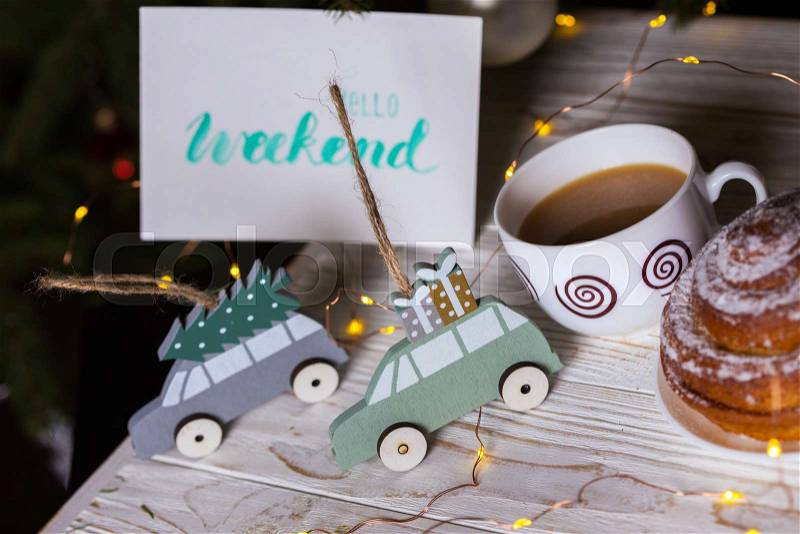 Christmas. New Year\'s toys and inscription hello weekend on the background of the Christmas tree , stock photo