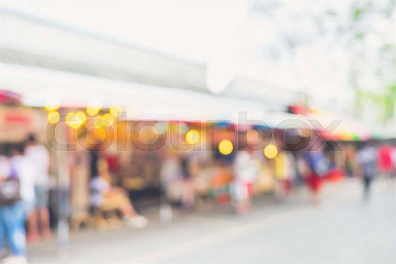 Blurred background : people shopping at market fair in sunny day, blur background with bokeh, stock photo