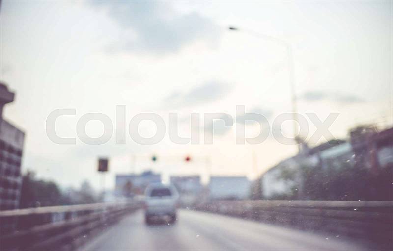 Blur background : see through window of car on high way road in evening with traffic light,Abstract background, stock photo