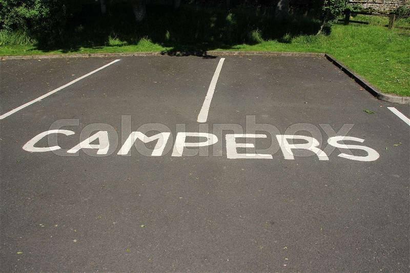 Parking place for campers in the village in England in the summer, stock photo