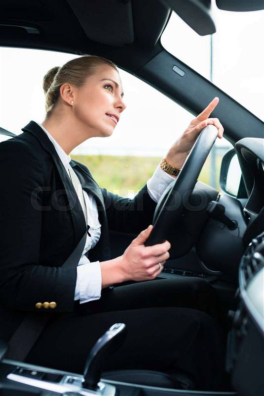 Woman in car being angry and cursing other driver, stock photo