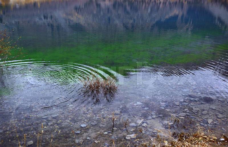 Ripples on the water in mountain lake. Canada, stock photo
