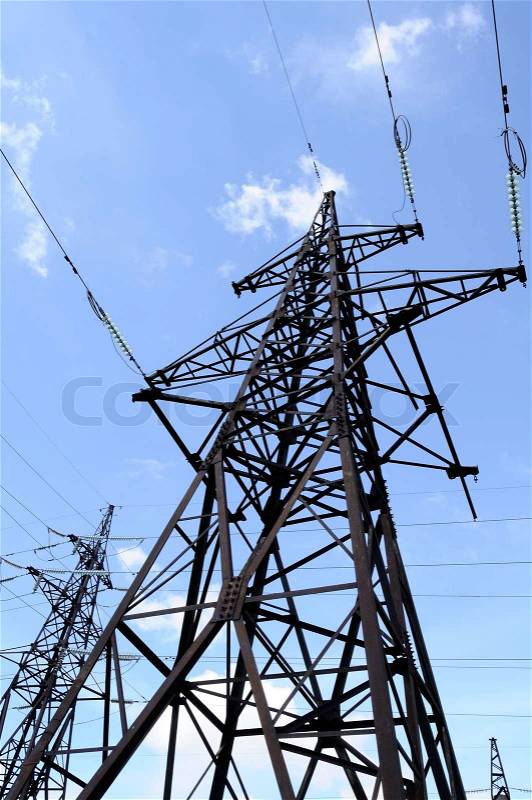 Electricity Pylon and Power Lines on Blue Sky Background, stock photo