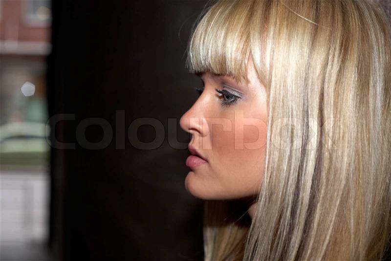 Side profile of young woman, close-up, stock photo