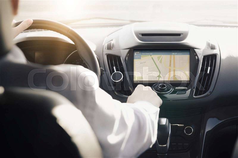 GPS navigation system. Person driving a car with satellite navigation, stock photo