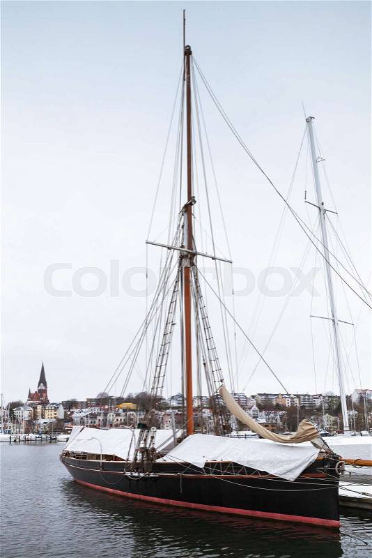 Sailing yachts moored in marina in winter. Flensburg, Germany, stock photo