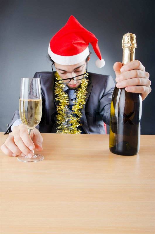 Drunken businessman after office christmas party, stock photo