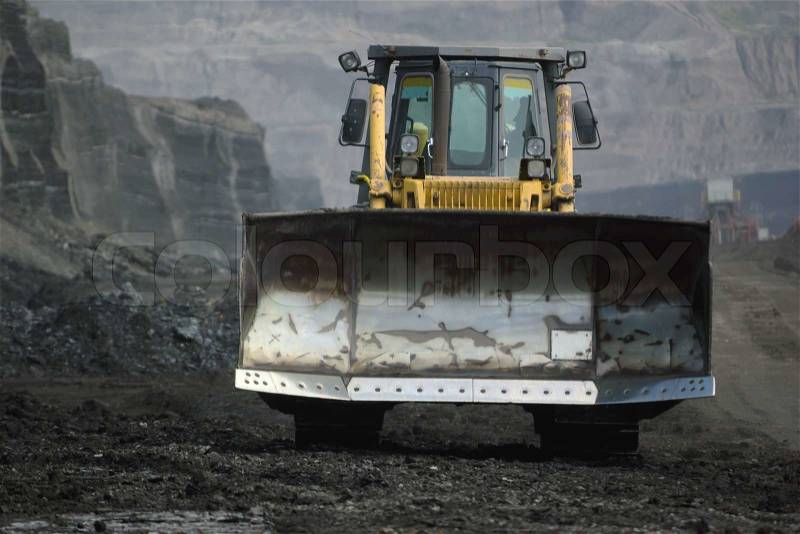 Bulldozer in coal mine, stock photo