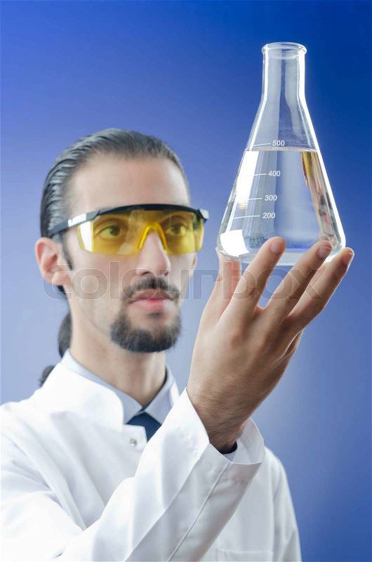 Young chemist student working in lab, stock photo
